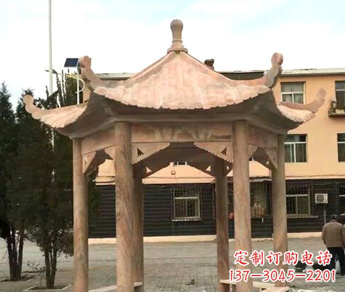 张掖园林晚霞红六角石雕凉亭